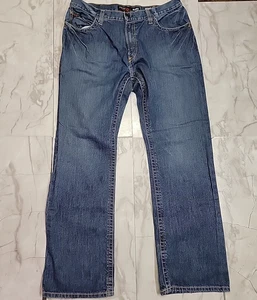 Pantalones de mezclilla Ariat M4 FR para hombre 36X34 azul corte bota relajado rodeo Western CAT 2 - Imagen 1 de 16