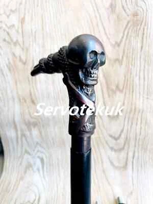 Antiguo bastón de madera negro victoriano con mango de cabeza de calavera de latón macizo Foto 1 de 4