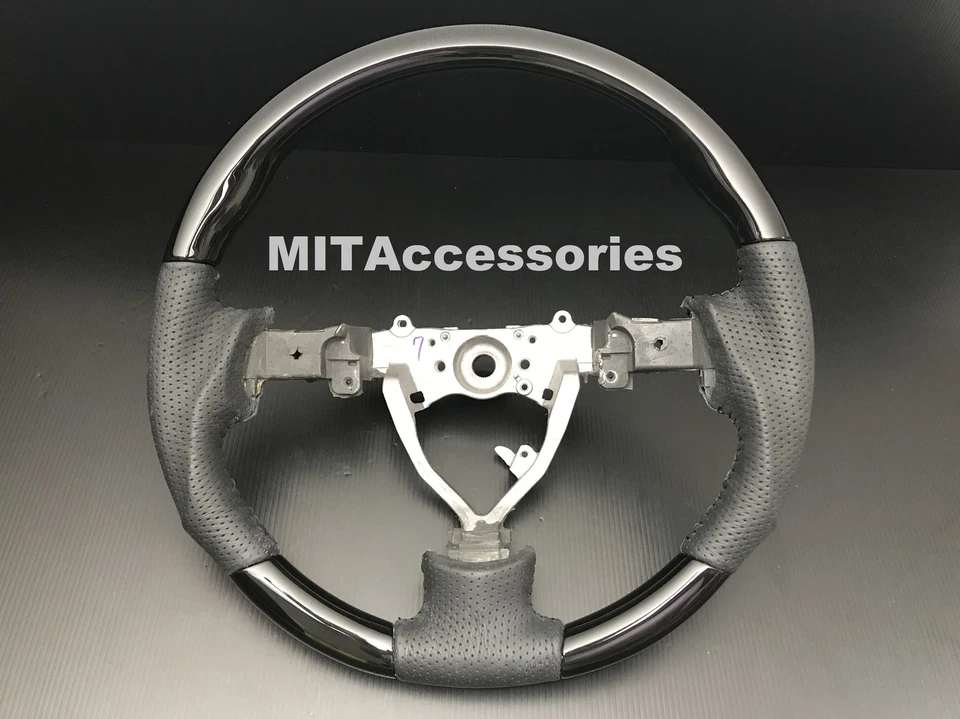 Volante de cuero genuino piano negro deportivo para Toyota FJ Cruiser 2006-2017 Foto 1 de 4