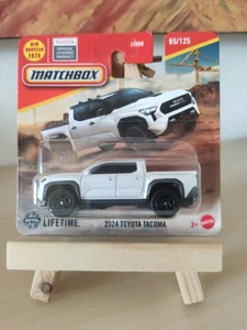 Matchbox Mattel 2024 Toyota Tacoma 2024 65/125 JBR28 Pick Up Bianco - Foto 1 di 2