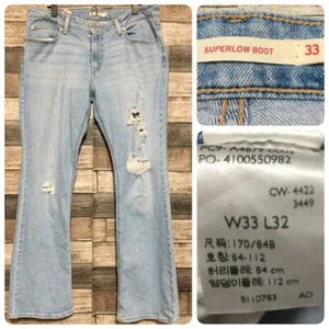 Levi’s Superlow Boot Jeans Women’s 33x32 Light Wash Blue Distressed Denim - Picture 1 of 10