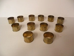 12 servilleteros de latón vintage figuras grabadas compradas y hechas en tailandia - Imagen 1 de 7