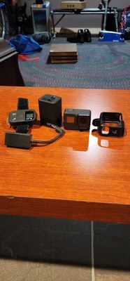 GoPro HERO7 Black Camera Bundle + Remote, Mic Adapter, Dual Charger, 2 Batteries - Image 1 of 4
