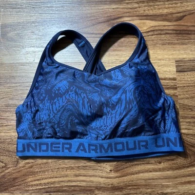 SUJETADOR DEPORTIVO UNDER ARMOUR ESTAMPADO CRUZADO MEDIO COMPRESIÓN AZUL/NEGRO 1X ACOLCHADO Foto 1 de 4