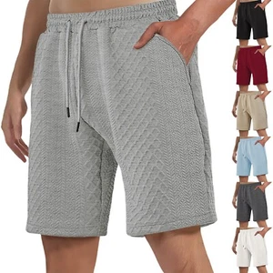 Pantaloncini uomo casual tinta unita retrò larghi e texture sport e casual spiaggia - Foto 1 di 33