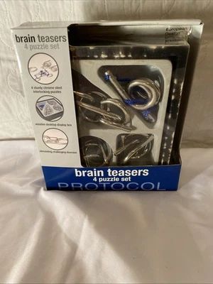 4-SET METAL BRAIN TEASERS fun New In Box. Item #847 - Image 1 of 4