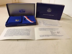 CAJA VACÍA Y CERTIFICADO DE AUTENTICIDAD para moneda de dólar de plata de la Estatua de la Libertad de Estados Unidos 1986 - Imagen 1 de 7