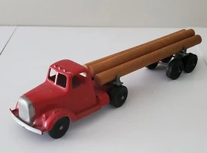 Camion Tootsie Toy modello L Mack con rimorchio per tronchi e tronchi anni 50 - Foto 1 di 7