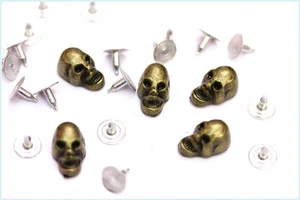 25pz Borchie teschio con rivetto bronzo antico *25pcs SKULL STUDS antique bronze - Picture 1 of 1