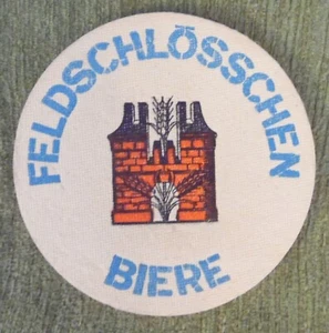 Tapa de cerveza, cervezas Feldschlösschen, redonda, 10,7 cm x 4 mm - Imagen 1 de 2