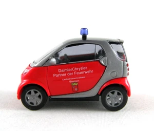 Busch 489305 Smart City Coupé Bomberos "Bremen" Ho 1:87 Nuevo - Imagen 1 de 1