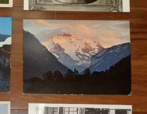 VIEW OF MOUNTAINS INTERLAKEN SWITZERLAND UNPOSTED POSTCARD VERLAG - Picture 1 of 2