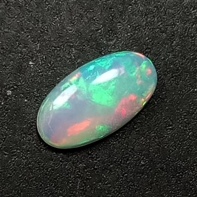 0.94Cts_Llamativadora piedra preciosa de ópalo blanco ovalada multicolor 100 % natural M244 Foto 1 de 4