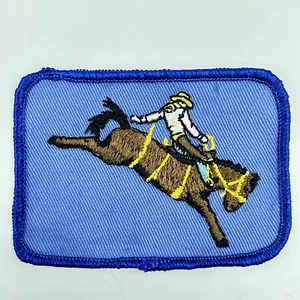 Vintage Embroidered Sew On Cloth Rodeo Saddle Bronc Riding Patch 3-1/2” X 2-1/2” - Picture 1 of 3
