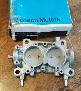 NOS GM 2bbl carburetor base plate Part number 679033 - Picture 1 of 11