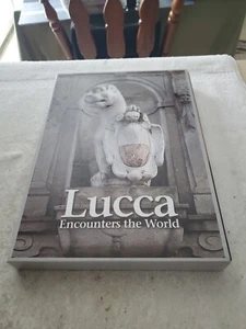 LUCCA ENCOUNTERS THE WORLD by Braccesi & Others - HBDJ 2009 w/SLIPCASE UNREAD - Picture 1 of 2