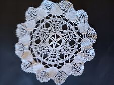 Vintage round white crocheted doily with scalloped edges.