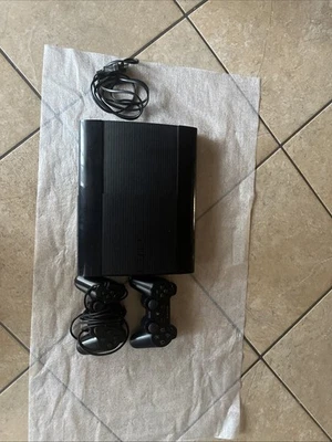 Sony PlayStation 3 60GB Console - Nera con cavo AC + 2 Controller + 19 Giochi - Immagine 1 di 2