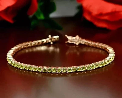 Elegante brazalete tenis chapado en oro amarillo de 14 k peridoto simulado corte redondo de 9 quilates Foto 1 de 4