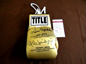 LEON & MICHAEL SPINKS 1976 OLYMPIC GOLD SIGNED AUTO TITLE BOXING GLOVE JSA GEM - Picture 1 of 4