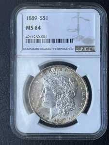 1889 Morgan Silver Dollar- NGC MS 64, Gold Toning - Picture 1 of 4