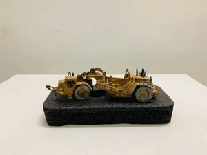 Cat 657G Wheel Tractor Scraper Muddy Edition 1/125 By DieCast Masters 85542 NEW - Picture 1 of 7