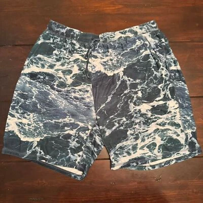 Pantalones cortos deportivos Reel Legends para hombre con estampado de océano verde y azul - grandes Foto 1 de 3