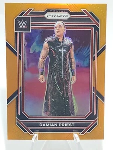 2023 PANINI PRIZM WWE PRIZMS ORANGE #143 DAMIAN PRIEST /99 PARALLEL - Picture 1 of 2