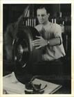 1940 Press Photo Man holding Goodrich's Ameripol tire in Akron, Ohio - pix21602