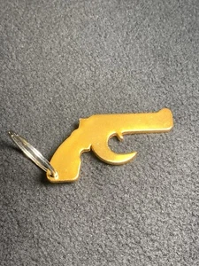 Llavero pistola metal dorado miniatura - Imagen 1 de 7