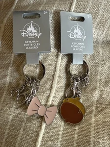 Disney Keychains Acorn and Pink Bow Lot of 2 Keychain Keyring Clip - Picture 1 of 5