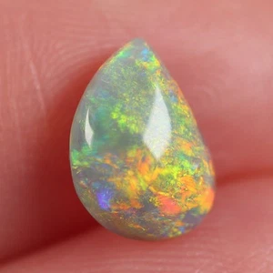 1.39ct Dark Australian Opal, Natural Solid Opal Polished Cabochon 7 x 9.4mm - Picture 1 of 7