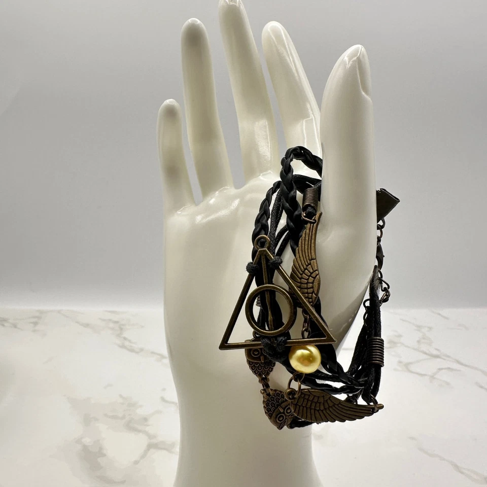 Pulsera artesanal con alas de búho Harry Potter cuentas doradas Reliquias de la Muerte Foto 1 de 4
