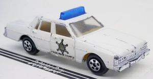 Coche de policía Ertl Dukes of Hazzard Pontiac Bonneville 1/64 luz azul (Singapur) - Imagen 1 de 2