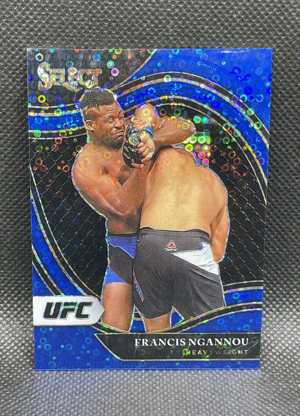 2021 Panini Select UFC Francis Ngannou Octagonside Prizm Blue Disco /99