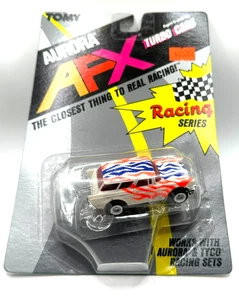 TOMY Aurora AFX Turbo Cars Chevy Nomad geflammt HO Slotcar NEU im Blister - Bild 1 von 3