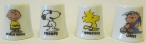 Up4Bid 8er Set Charlie Brown & Friends Sammlerstück Porzellan Fingerhut - Bild 1 von 2