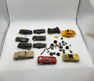 Lot de pièces détachées vintage AFX - voiture de course 4 corps, châssis, moteurs, essieux - Photo 1 sur 12