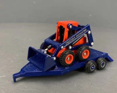 1:50 Eastwood/Ertl Diecast Chester’s Excavating Skid Steer & Trailer D1242 - Image 1 of 4