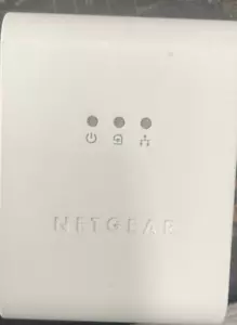 Single Netgear XE104 85 Mbps Powerline Wall Plugged 4-Port Ethernet Switch - Picture 1 of 4