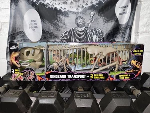 KID GALAXY DINOSAURIER TRANSPORT MIT 3 BEWEGLICHEN DINO FIGUREN, LICHTERN & SOUNDS, GRAU - Bild 1 von 5