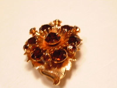 Gold colored leaf shpaed pin accented with amber/ brown crystals - Image 1 of 4