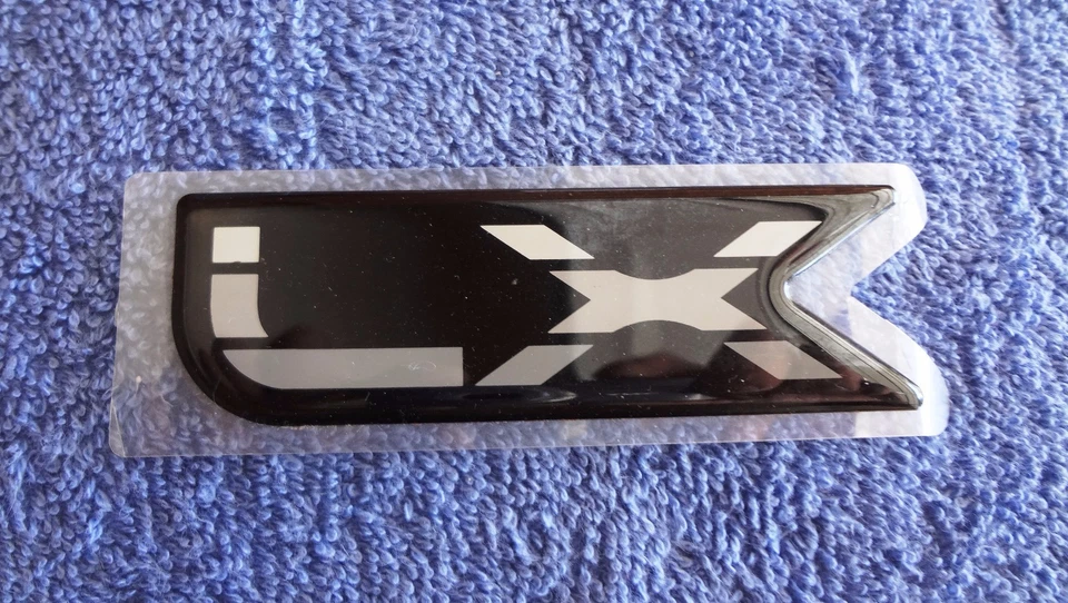 NOS NEW 80's 90's ? Original Ford Escort (?) LX Sticker Fender Ornament Emblem - Image 1 of 1