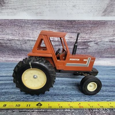 Hesston Fiat 980 diecast frame plastic cab 1/16 scale w/front tractor black/brn - Image 1 of 4