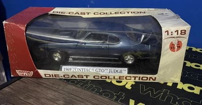 Motor Max 1/18 Scale 1969 Pontiac GTO Judge Navy Blue - Image 1 of 4