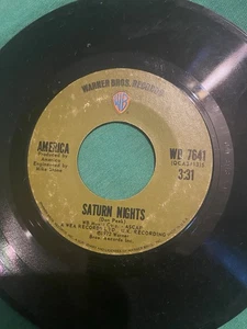 America 45 Vinyl Single Record Saturn Nights / Venture Highway Warner Bros - Foto 1 di 4