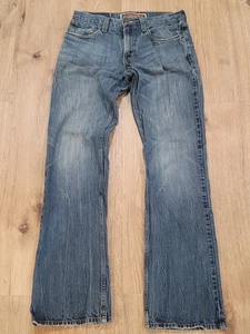 Levis Jeans 32x34 Blue 527 Low Boot Cut Denim Western Cowboy Faded Fraying Hems - Picture 1 of 12