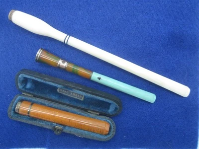 ANTIQUE GOLD & BAKELITE / AMBER CIGARETTE CIGAR HOLDERS - LOT OF 4 - AMAZING! - Image 1 of 4