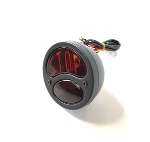 Faro Trasero Negro Grinzato Con Letras Stop Ø 98mm - Imagen 1 de 3