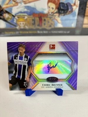 Autógrafos Topps Tier One Bundesliga 2021 púrpura Cedric Brunner/50 Foto 1 de 3